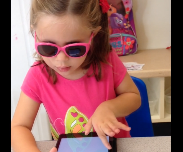 Child using BLV FirstSteps app on iPad